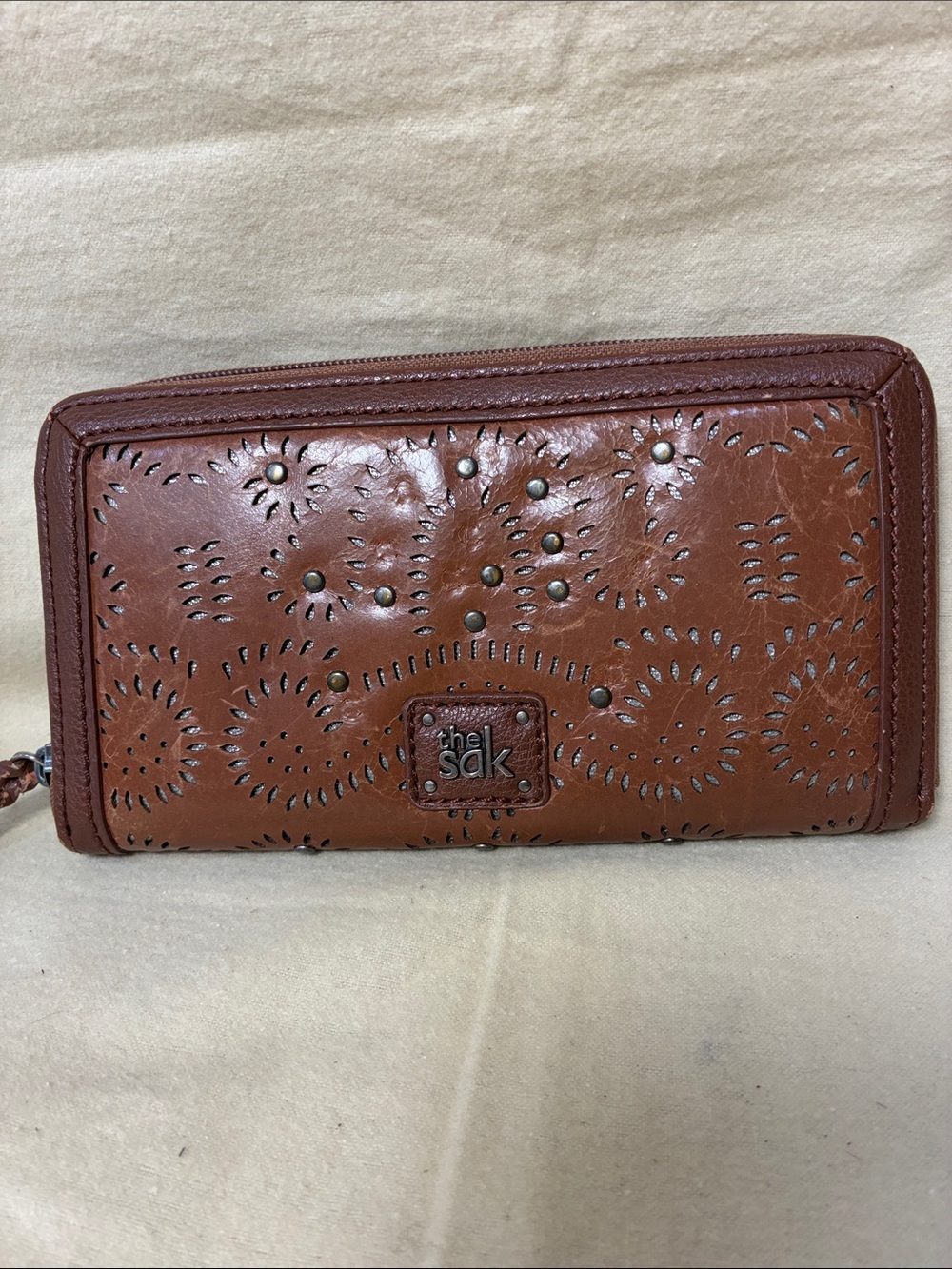 The Sak Brown Leather Zip-Around Wallet with Laser-Cut Motif